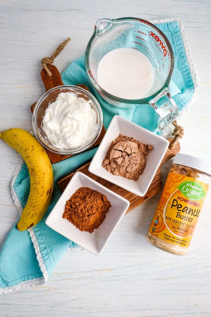 Ingredients needed to make a chocolate peanut butter smoothie.