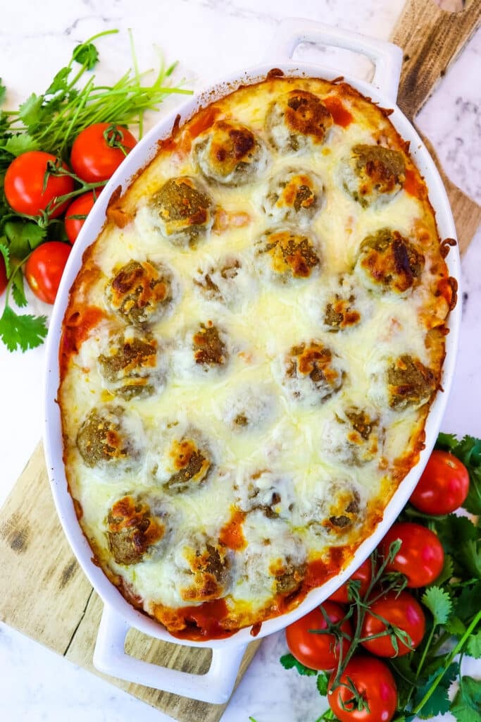 Dump and bake meatball casserole recipe baked with lightly browned cheese.