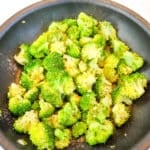 Sauteed broccoli with garlic in a skillet.
