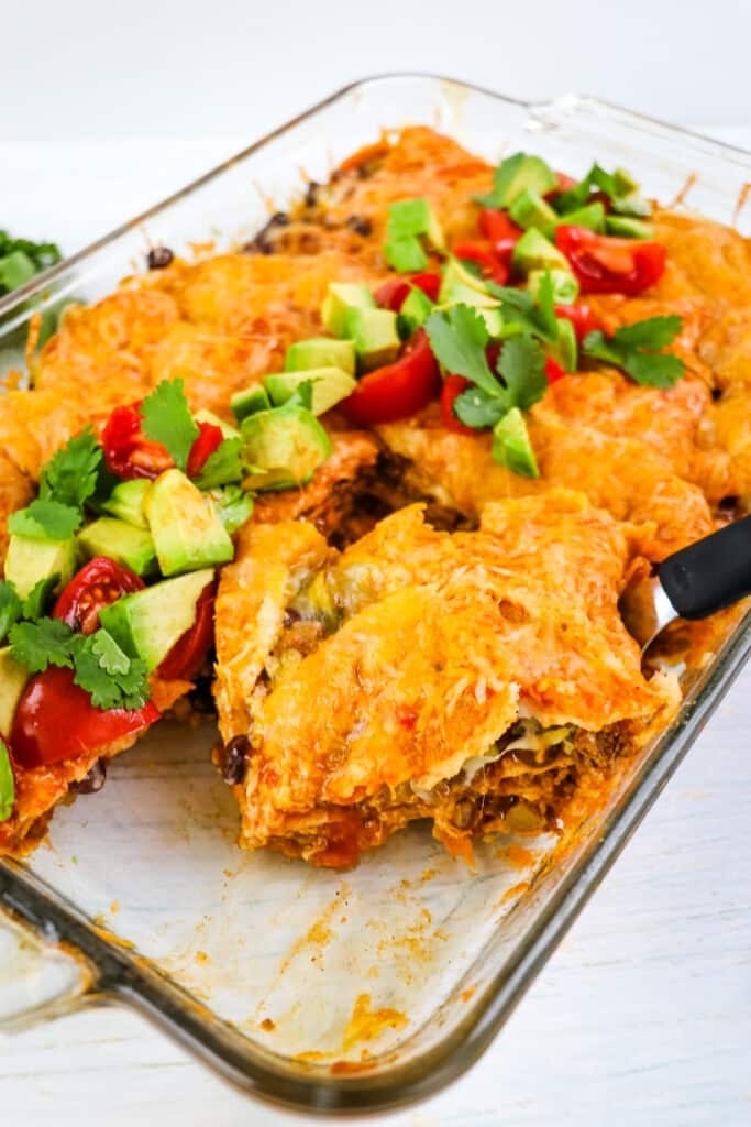 Serving of beef enchilada casserole recipe on serving spatula.