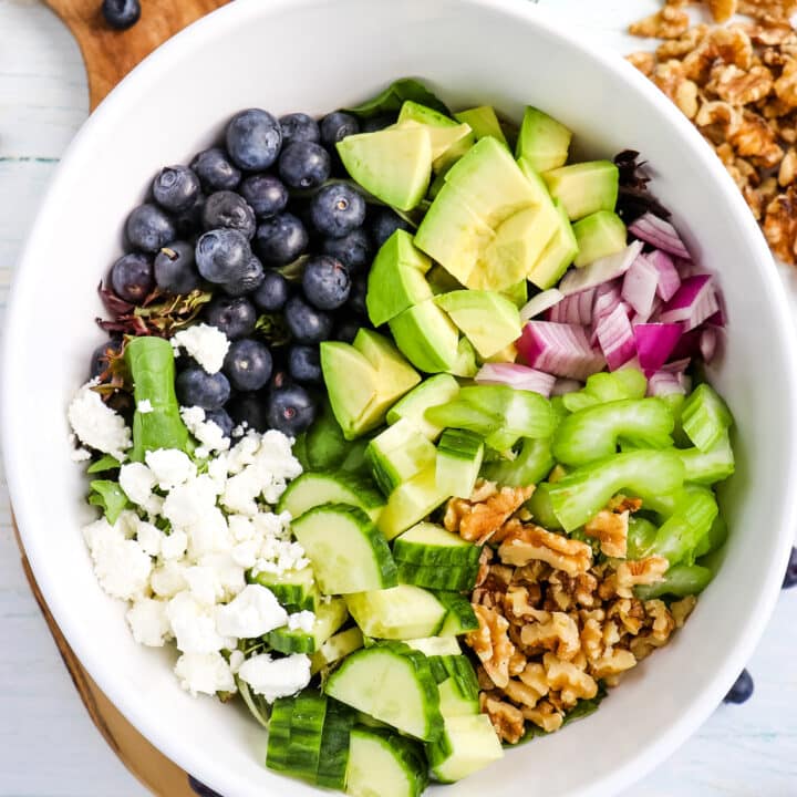 Blueberry spring mix salad with cucumbers, avocados, celery, walnuts and goat cheese crumbles.