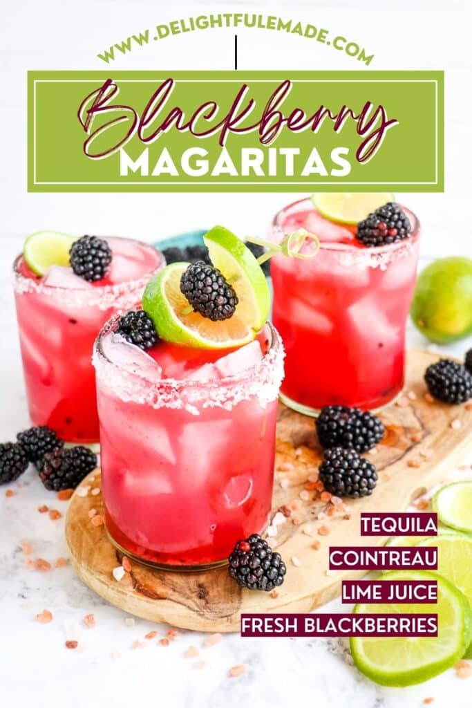 Three blackberry margaritas with salted rims and garnished with lime slices and fresh blackberries.