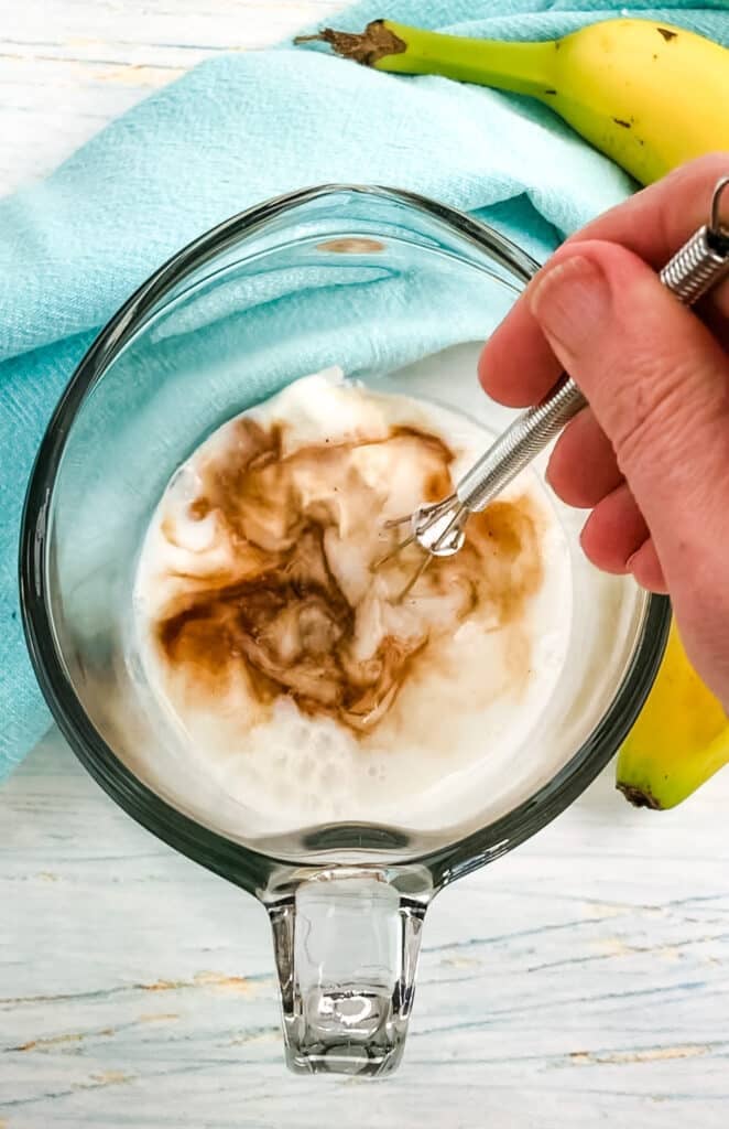 Liquid ingredients needed to make peanut butter overnight oats.