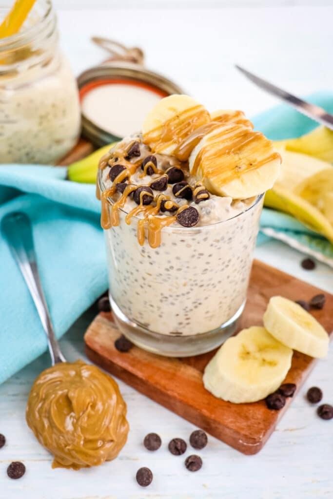 Peanut butter banana overnight oats topped with sliced banana, peanut butter and chocolate chips.