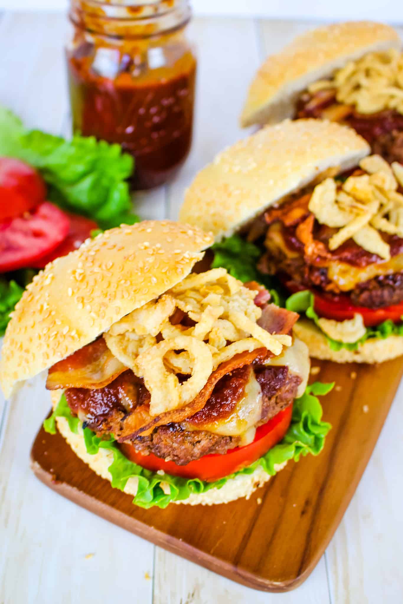 BBQ bacon burgers topped with cheese, bbq sauce, bacon and French fried onions.