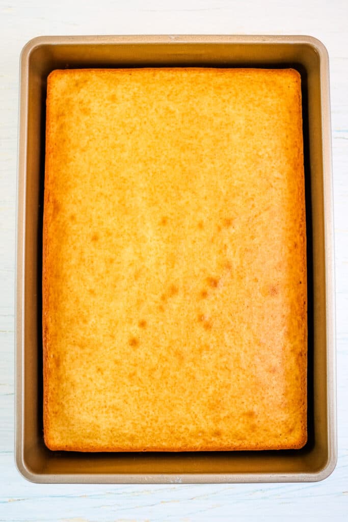 White cake baked in a pan for making a lemon jello cake.