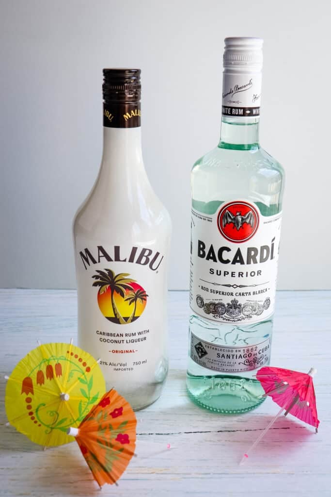 Two bottles of rum; Malibu rum and Bacardi rum for making a mojito.