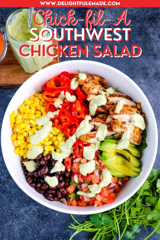 Southwest chicken salad in a bowl, topped with avocado ranch dressing and cilantro on the side.