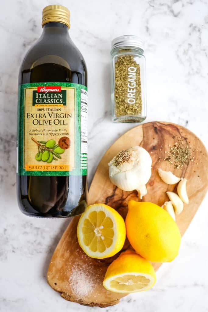 Ingredients needed to make lemon and olive oil dressing.