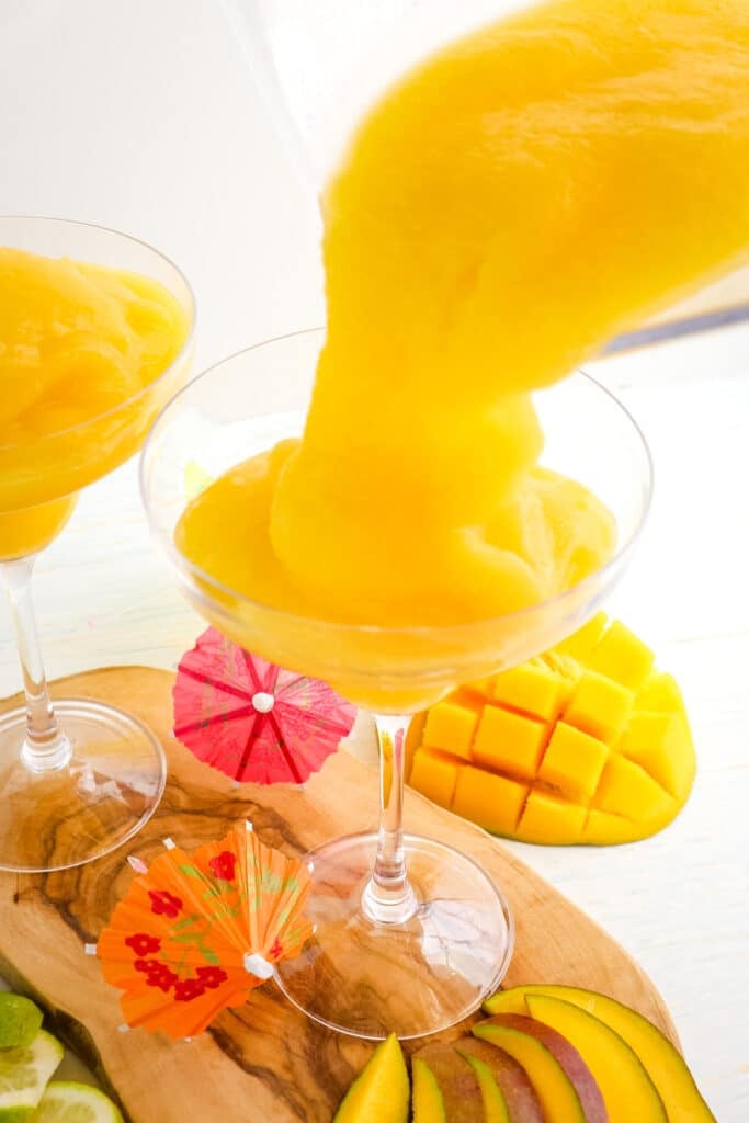 Mango daiquiri being poured into a glass.