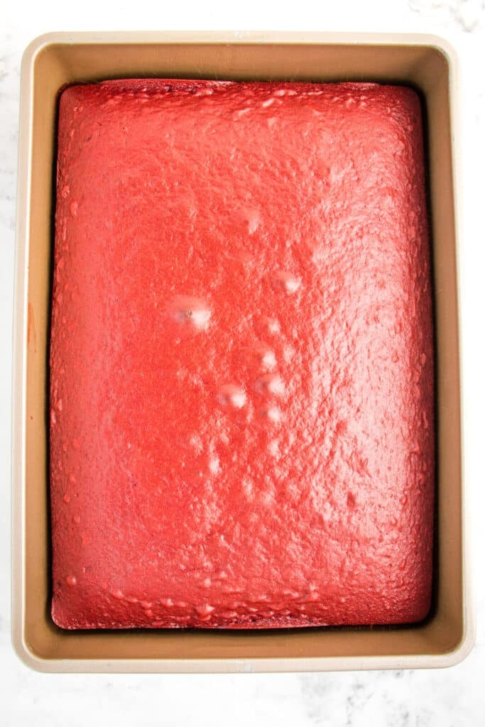 Red velvet cake baked in a 9 x 13" cake pan.