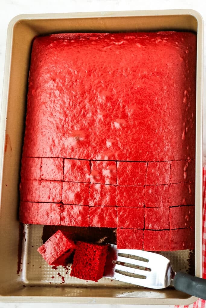 Red velvet cake cut into small squares for assembling cake parfaits.