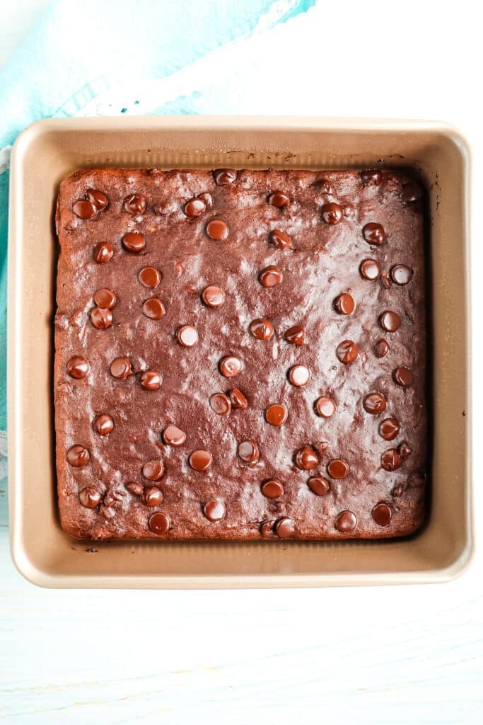 Healthy banana brownies baked in a square pan.