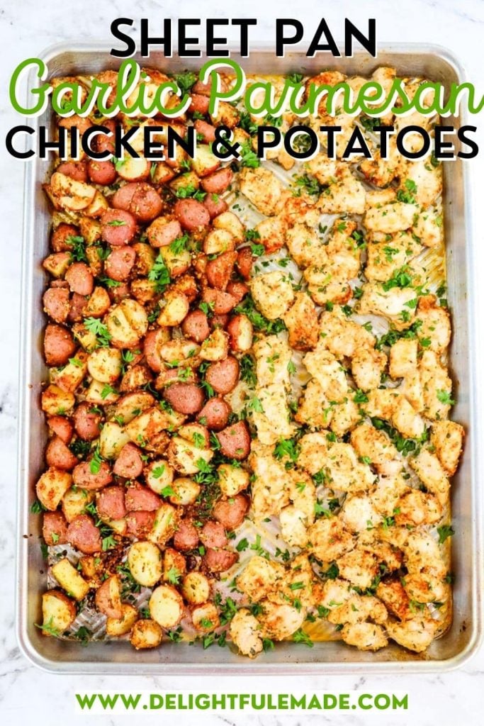 Sheet pan garlic parmesan chicken and potatoes topped with chopped parsley.