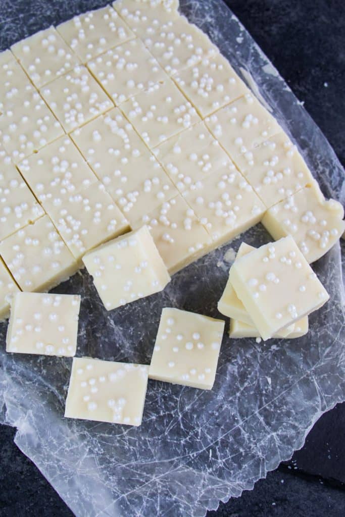 Vanilla fudge recipe with sprinkles and cut into squares.