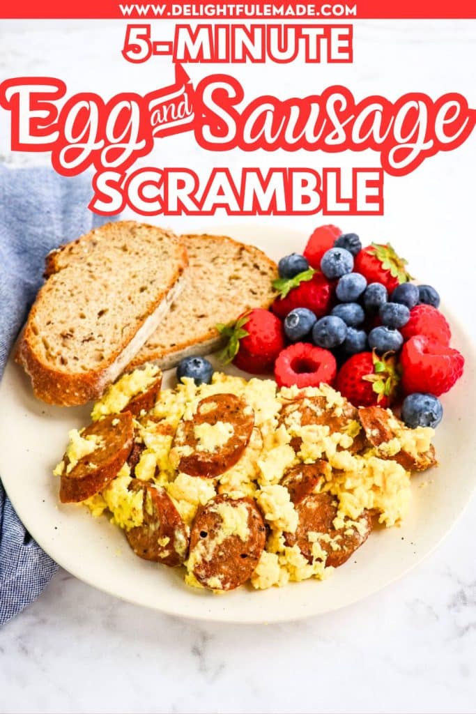Sausage egg scramble with a side of berries and toast on a plate.