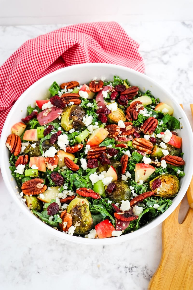 Roasted Brussels sprouts salad with kale, quinoa, apples, cranberries and feta cheese.