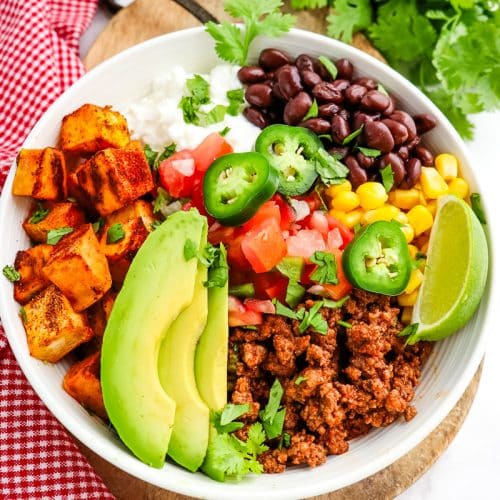 Sweet potato taco bowl with ground beef, cottage cheese, beans and avocado.