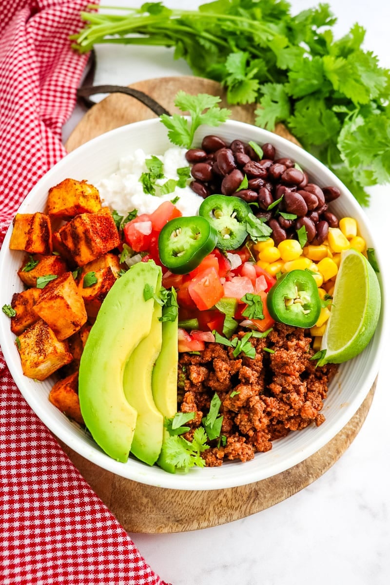 Sweet potato taco bowl with ground beef, cottage cheese, beans and avocado.