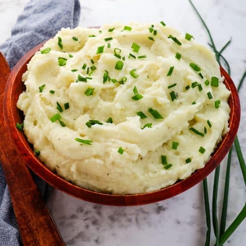 Boursin mashed potatoes with fresh chives on top.
