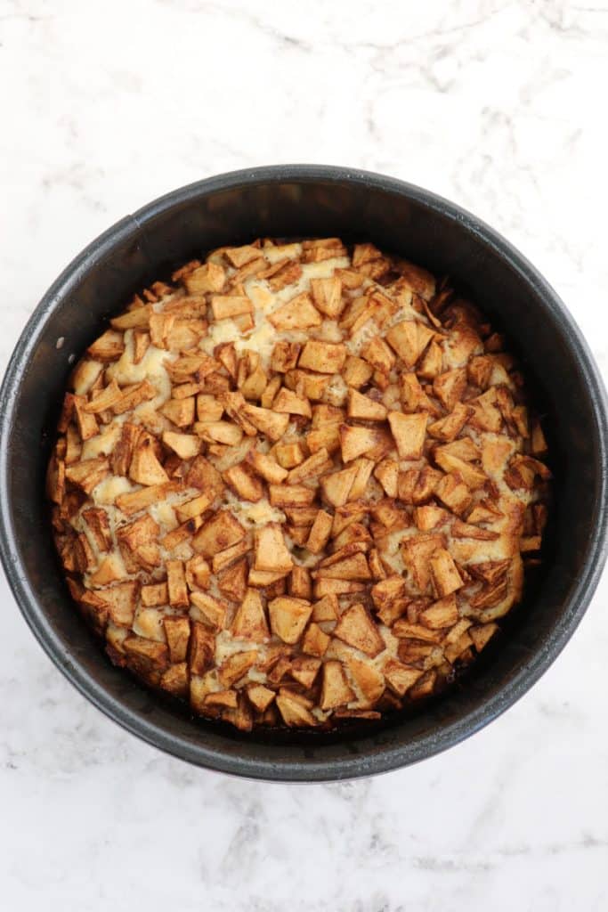 Dutch apple cake after being baked in cake pan.