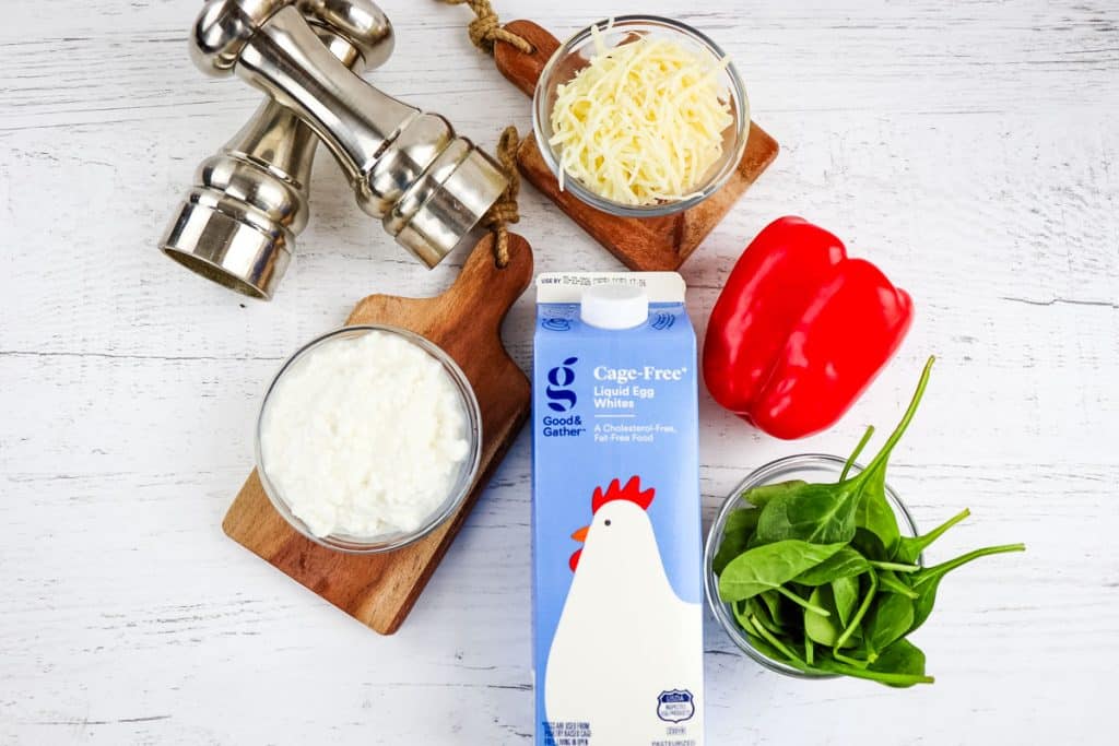 Ingredients needed to make egg white bites with spinach and red bell pepper.