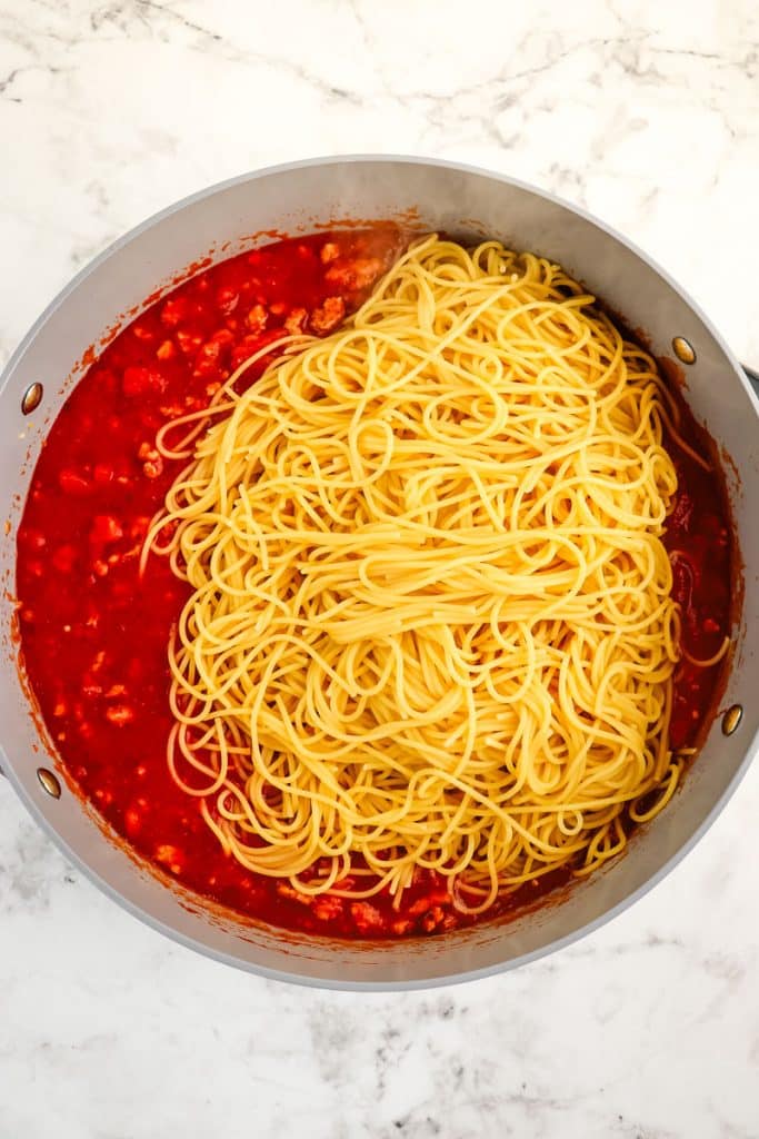 Ground turkey in marinara sauce with cooked spaghetti added to it.