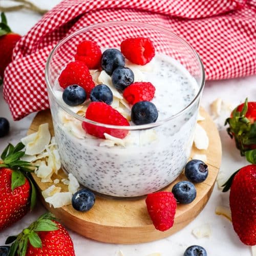Coconut milk chia pudding topped with fresh berries and toasted coconut.