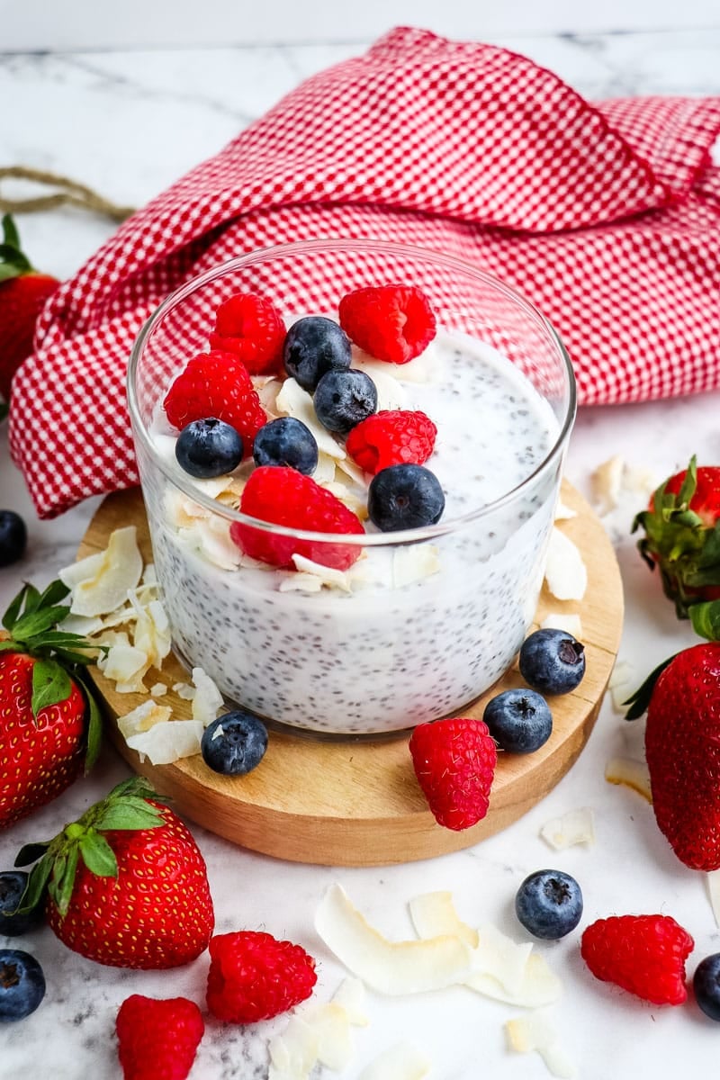 Coconut milk chia pudding topped with fresh berries and toasted coconut.