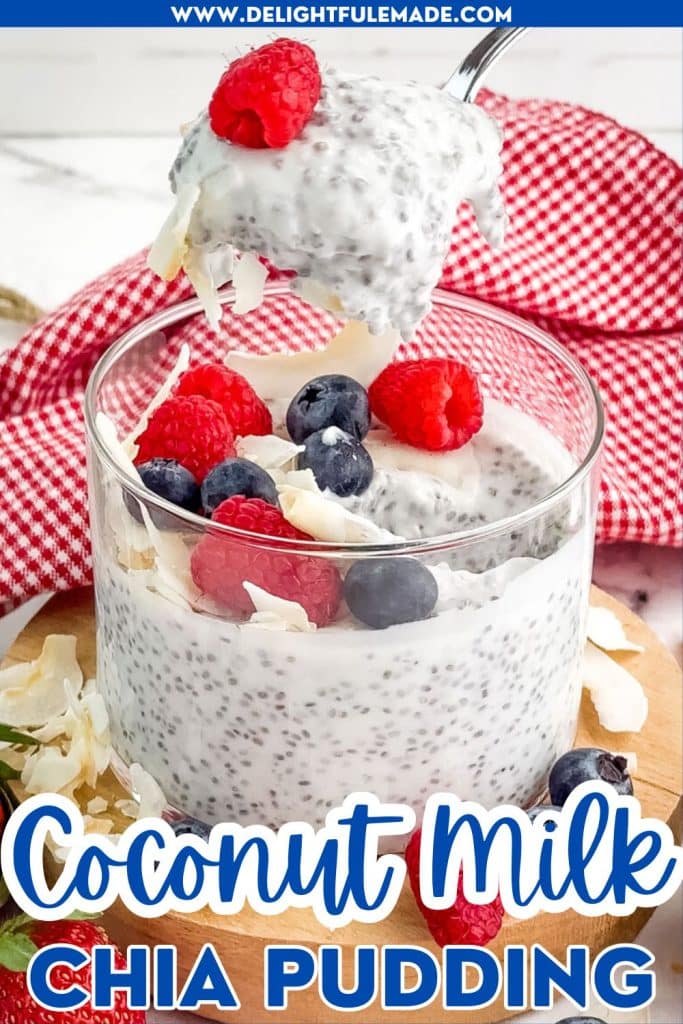 Coconut milk chia pudding being spooned out of jar, topped with fresh berries.