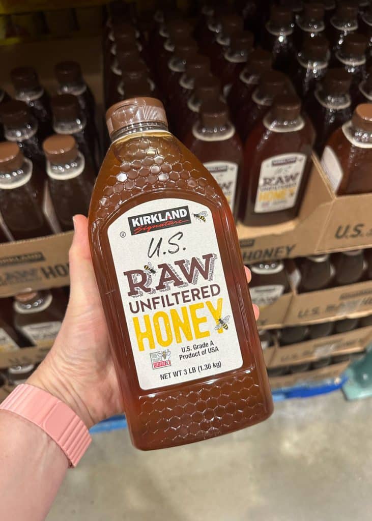 A container of raw honey from Costco.