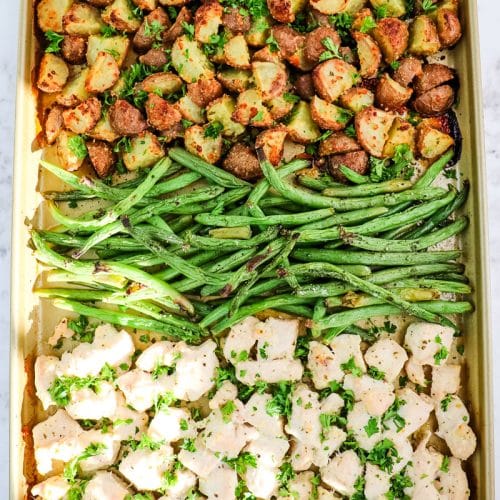 Sheet pan ranch chicken, potatoes and green beans that have been roasted in the oven.